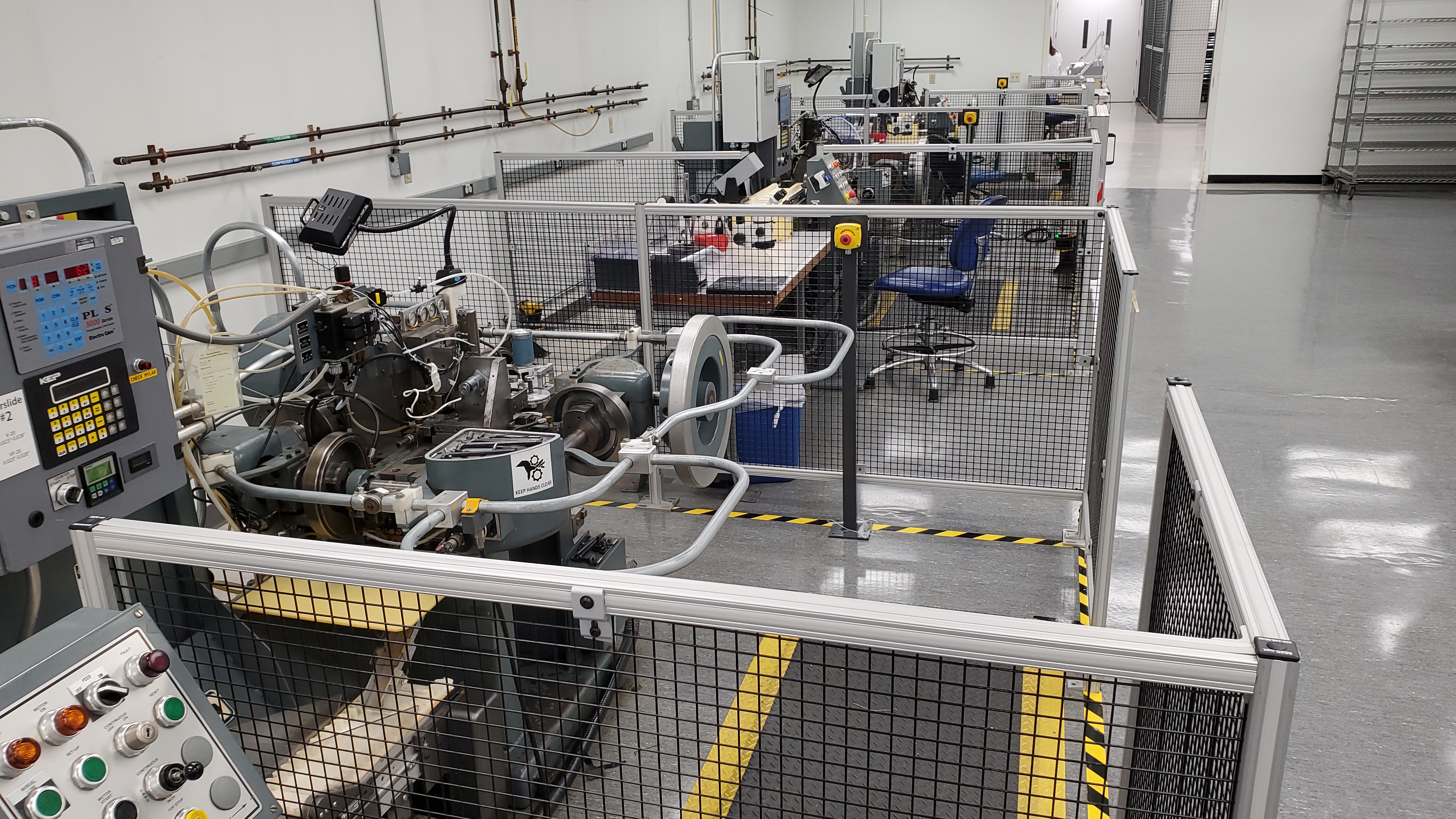 Four-Slide production room with multiple machines and integrated perimeter guarding